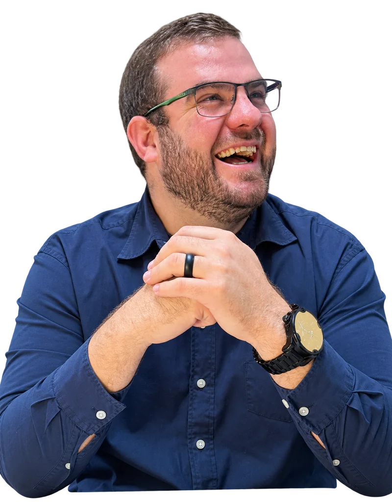 Andre laughing at his desk